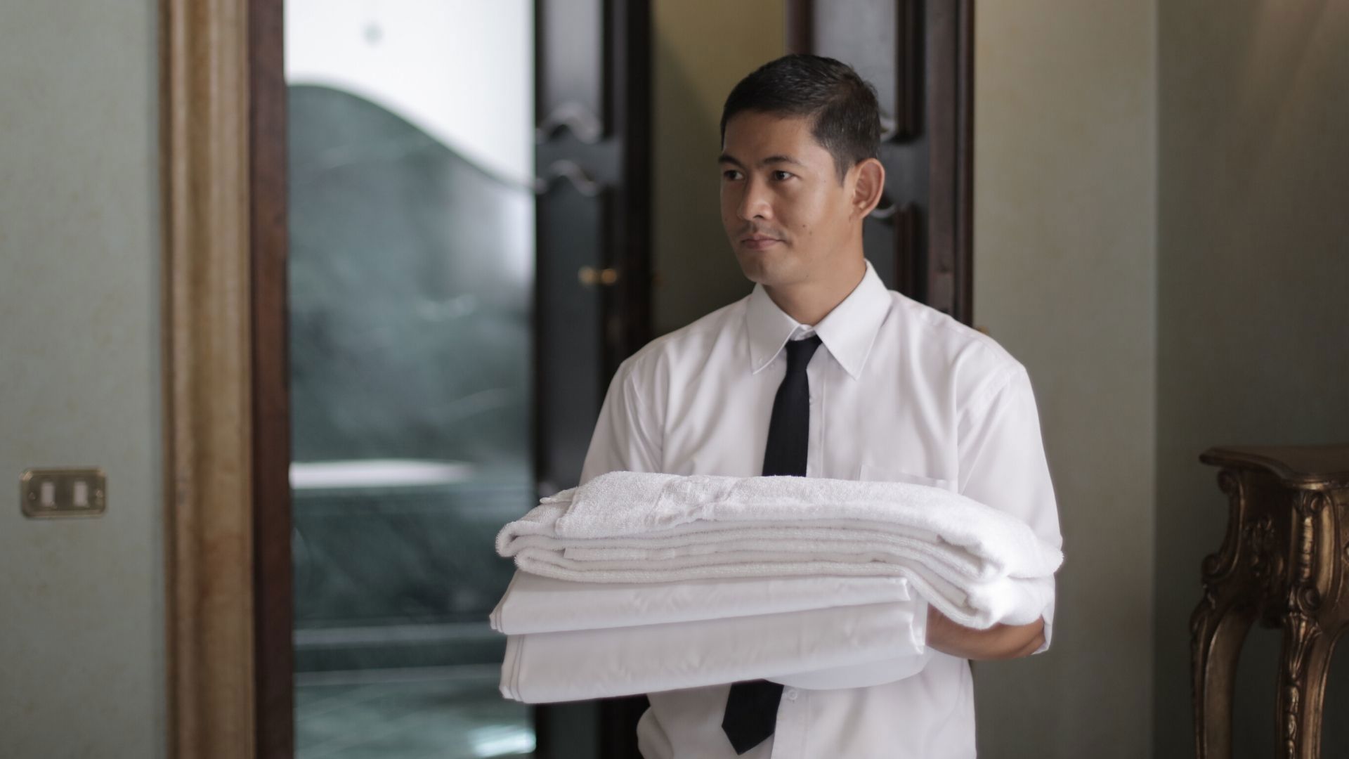 Hotel Staff Delivering Linen