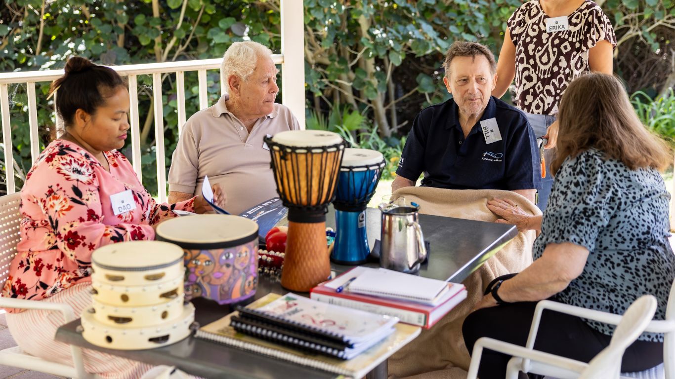 BrightRespite Dementia Retreat_music exercise outdoors at Joondalup Resort with bongo drums and tamborines