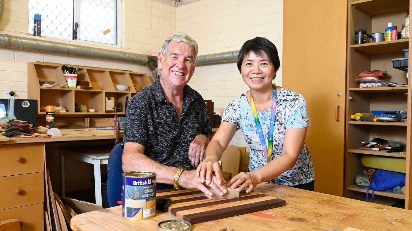 Brightwater Marangaroo Transitional Accommodation Program_disability client with support worker helping enjoy woodwork hobby